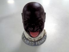 A cast iron novelty money box - Smilin Sam salted peanuts