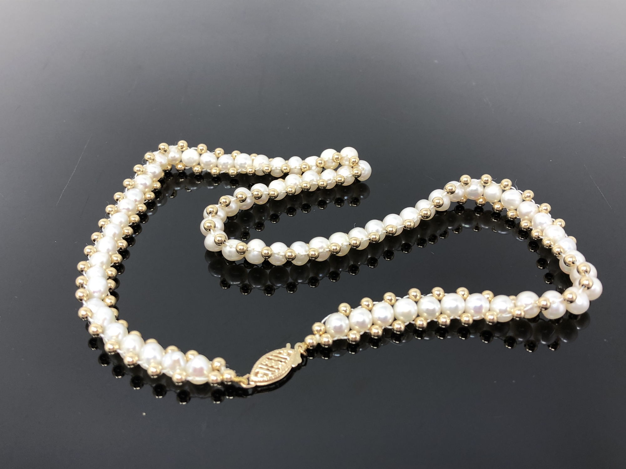 A pearl necklace with 14ct gold clasp and beads