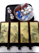 A tray containing oriental wares to include a four way folding screen, carved wooden figures,