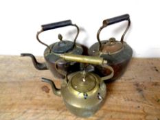 Three antique copper and brass kettles