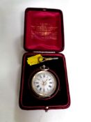 A silver fob watch with enamel dial and key in box