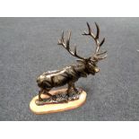 A cast iron figure - Stag on wooden plinth