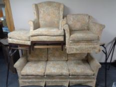 A 20th century four piece lounge suite upholstered in a floral fabric