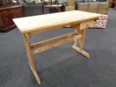 An adjustable pine draftsman's desk
