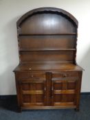 An Ercol elm and beech Dutch dresser in an oak finish