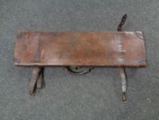 An antique James Woodward and Sons leather gun case containing cleaning rods and flask