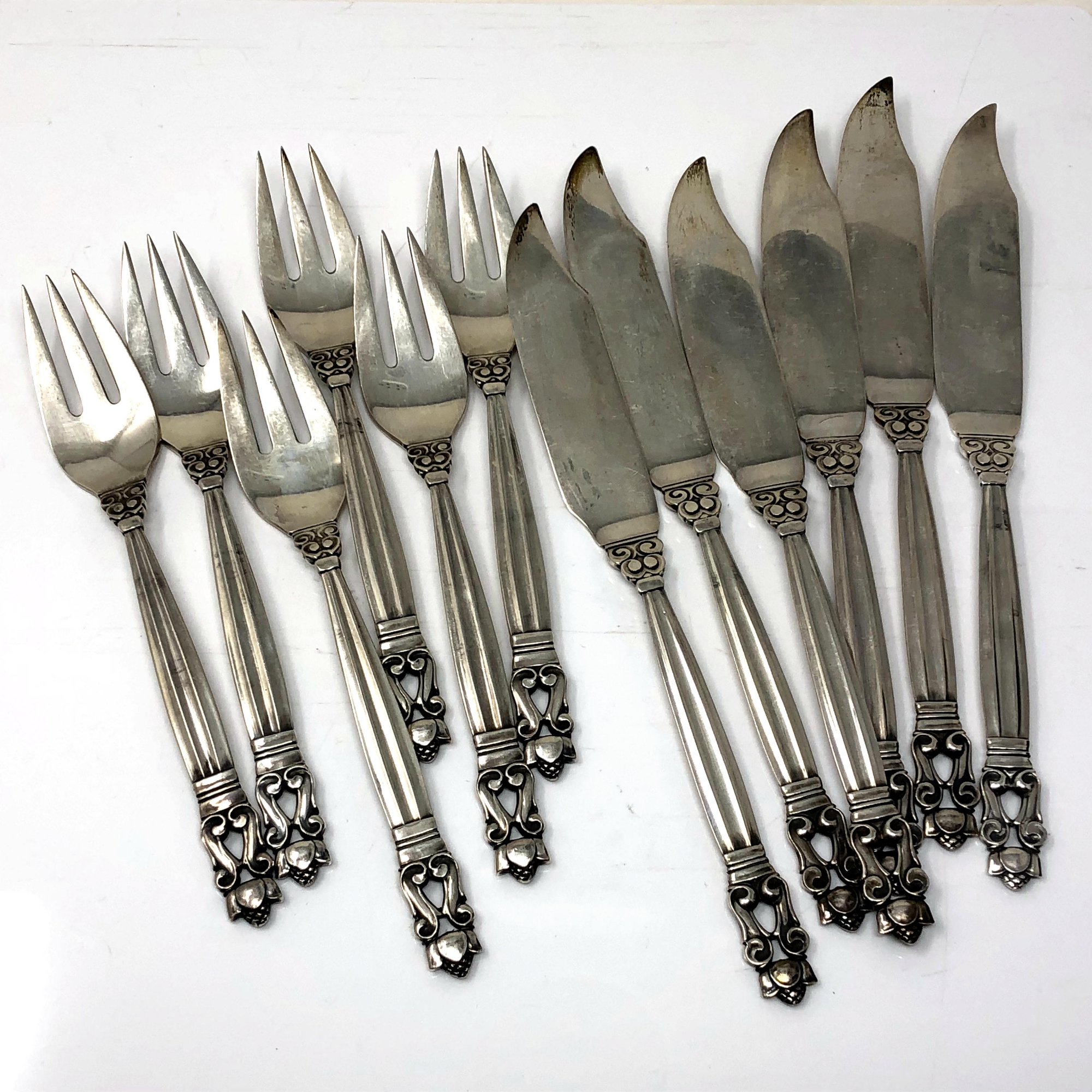 A superb set of vintage Georg Jensen acorn pattern fish knives and forks