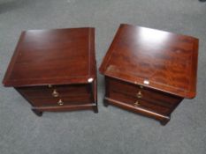A pair of Stag Minstrel two drawer bedside chests with slide