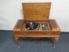 A Dynatron music centre with Garrard SP25MKIV turntable in table