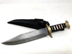 A Bowie knife with Damascus steel blade, camel bone and buffalo horn grip with brass mounts,