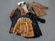 A box containing assorted lady's coats to include fur coat, sheepskin coat,