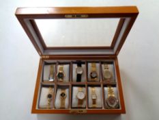 A watch display box containing ten assorted wrist watches, Avia, Rotary,