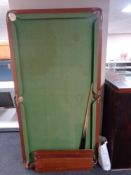 A 6ft snooker table with cues and accessories