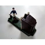 A cast iron novelty money box - Football