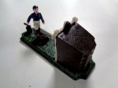 A cast iron novelty money box - Football