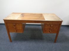 A mid 20th century Scandinavian teak twin pedestal desk
