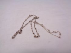 A silver chain and silver bracelet