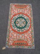 A Kashmiri chain stitch rug, 114cm by 61cm.