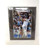 A signed photograph - Alastair Cook, 19 cm x 29.5 cm, mounted.