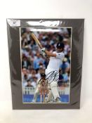 A signed photograph - Alastair Cook, 19 cm x 29.5 cm, mounted.