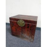 A Chinese style chest with brass mounts