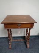 A 19th century inlaid mahogany work table with under stretcher