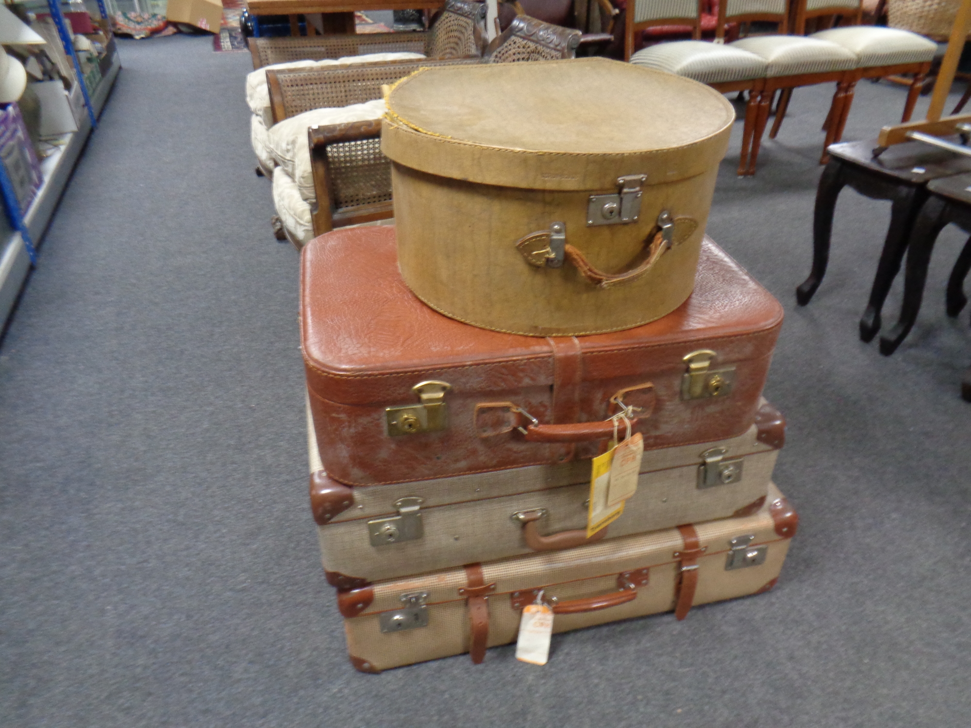 Three 20th century luggage cases together with a further vintage hat box