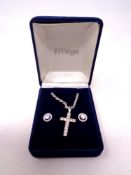 A silver cross on chain together with cluster earrings