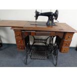 A 20th century Singer treadle sewing machine in table