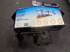 A boxed mitre saw together with a wall lantern