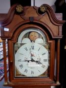 A 19th century oak longcase clock with moonphase dial (case cut down)