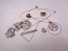 A quantity of silver items, pendants,