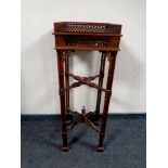 A reproduction Chippendale style fret work plant stand
