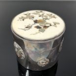 A Japanese silver dressing table pot, the inlaid ivory lid with shibayama decoration,