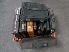 A crate containing a quantity of briefcases and laptop bags