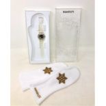 A Swatch Snow Your Time Away watch with mittens in box.