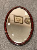 A bevelled early twentieth century mirror, 73 cm x 45 cm.