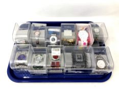 Eleven various Swatch watches in plastic display cases (one a/f).