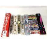 A group of five various Swatch watches in plastic cases, together with A Beijing 2002 watch,