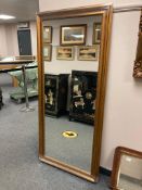 A rectangular bronze effect mirror,