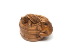 A carved Chinese hardwood netsuke - Frog and turtle in barrel