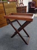 A butler's tray on folding stand