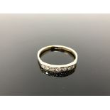 A 9ct gold diamond half eternity ring, size Q.