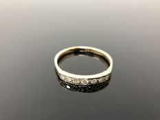 A 9ct gold diamond half eternity ring, size Q.