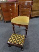 An antique beech wood dining chair together with a tapestry upholstered footstool on paw feet
