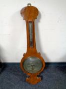 An antique banjo barometer by T Littlewood with silvered dial