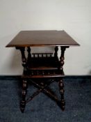 An Edwardian square occasional table with undershelf and gallery