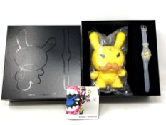 A Kidrobot for Swatch Special Edition wristwatch in box with figure.