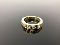 An 18ct gold diamond set half eternity ring, approximately 0.5 carat total weight, size I/J. 5.