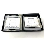 A pair of silver Concorde photo frames by Carrs of Sheffield, 2003, each 12cm by 12cm, boxed.